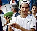 Spain's Albert Montanes with the trophy after winning the Estoril Tennis Open in Oeiras, Portugal, on Sunday.