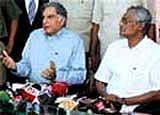 Tata Group, Ratan Tata and West Bengal Industry Minister Nirupam Sen talk to the media after a close-door meeting in Kolkata on Tuesday. PTI