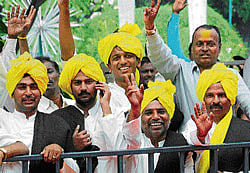 Supporters rejoice in front of the Raj Bhavan. DH Photo