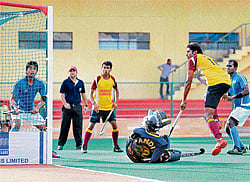 ON&#8200;TARGET: Karnatakas Nitin Thimmaiah (second from right) scores past Himachal Pradesh goalkeeper Munish Kumar in the Senior National hockey championship on Tuesday. DH PHOTO