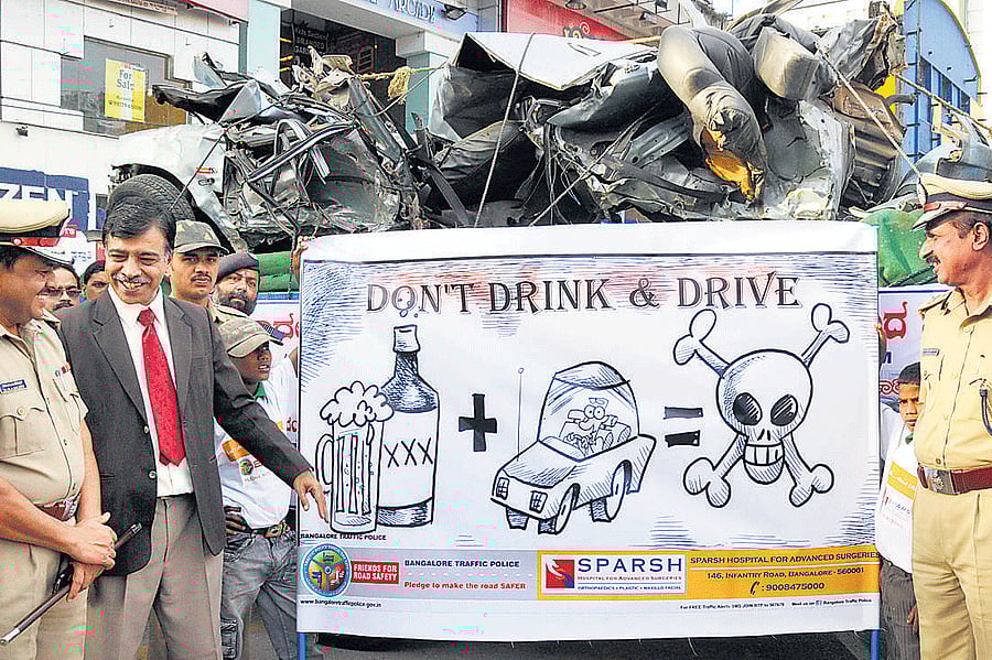 POSITIVEMEASURES The battered car and illustrations displayed by the traffic police on Brigade Road have had an impact on drivers in the City.