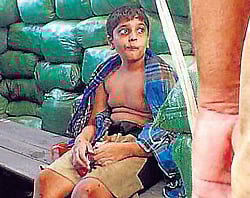 GRUESOME END: Former LTTE chief Velupillai Prabhakarans 12-year-old son Balachandran Prabhakaran sitting in a bunker, alive and unharmed in the custody of Sri Lankan troops. The  picture at the right which was taken a few hours later shows the boys body lying on the ground, his chest pierced by bullets. Picture courtesy dbsjeyaraj.com/No War Zone/Channel 4