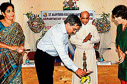 IGP (Western Range) Prathap Reddy lights lamp to inaugurate a one-day workshop on Human Rights Advocacy at St Aloysius College in Mangalore on Wednesday. DH photo