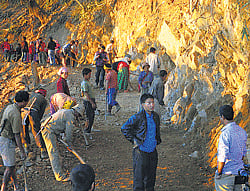 Armstrong Pame with labourers