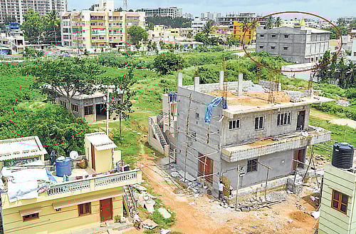 The buildings that have come up on the Hulimavu lake bed. DH Photo