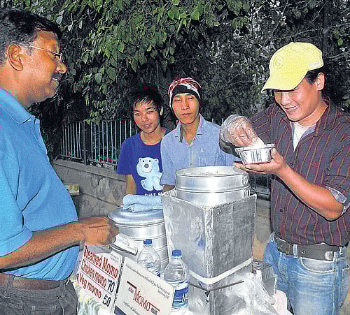 Captain Dawson buying momos from Suraj. DHNS