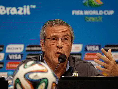Uruguay's head coach Oscar Tabarez makes a statement during a press conference the day before the round of 16 World Cup soccer match between Colombia and Uruguay at the Maracana Stadium in Rio de Janeiro, Brazil, Friday, June 27, 2014. FIFA banned Uruguay striker Luis Suarez from all football activities for four months on Thursday for biting an opponent at the World Cup, a punishment that rules him out of the rest of the tournament and the start of the upcoming Premier League season. AP