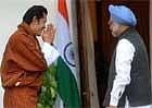 King of Bhutan, Jigme Khesar Namgyel Wangchuck (L) greets Indian Prime Minister Manmohan Singh at a meeting in New Delhi on  Tuesday. AFP