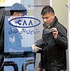 An Airport Security Forces official searches a passenger at the international departure lounge of Benazir Bhutto Airport in Islamabad, Pakistan, on Monday. AP