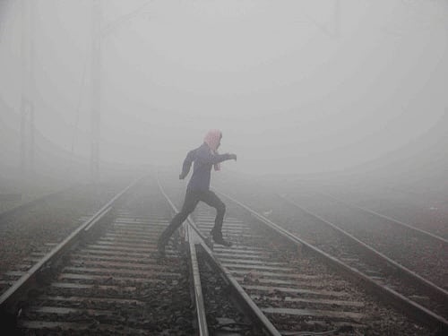 North India today shivered under biting cold as the mercury dipped in several places including Delhi where it settled at five years' lowest at 2.6 degrees Celsius, with dense fog adding to the woes by disrupting road, rail and air traffic.PTI Photo