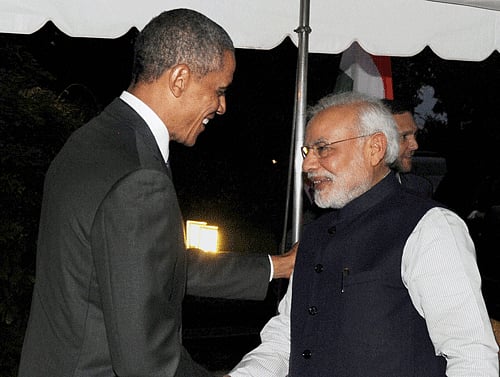 President Barack Obama has assured Prime Minister Narendra Modi that he will look into India's concerns on the H-1B visa issue as part of his comprehensive immigration reform, US officials said today. AP File Photo.