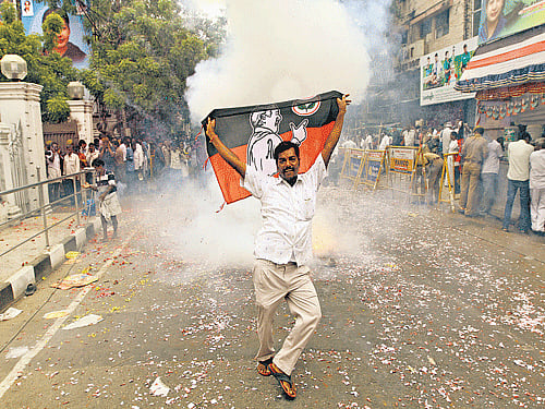 Amma's Day: An AIADMK supporter dances during celebrations in Chennai after party chief J Jayalalitha was cleared of corruption charges by the Karnataka High Court on Monday. Reuters