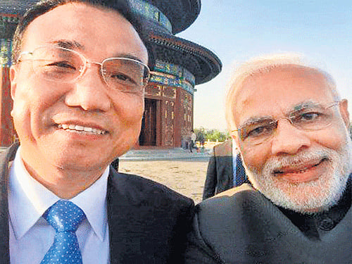 Camera-derie: The selfie of Prime Minister Narendra Modi with Chinese Premier Li Keqiang at the Temple of Heaven in Beijing on Friday. Taken a selfie! Thank you Premier Li., Modi posted in his Chinese microblog Weibo account. The iconic selfie is being dubbed the most power-packed selfie in history by the western media. PTI
