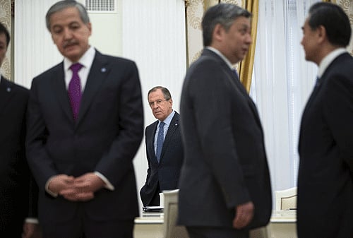 Russian Foreign Minister Lavrov and representatives of the Shanghai Cooperation Organisation wait for the arrival of President Putin during meeting in Moscow. Reuters