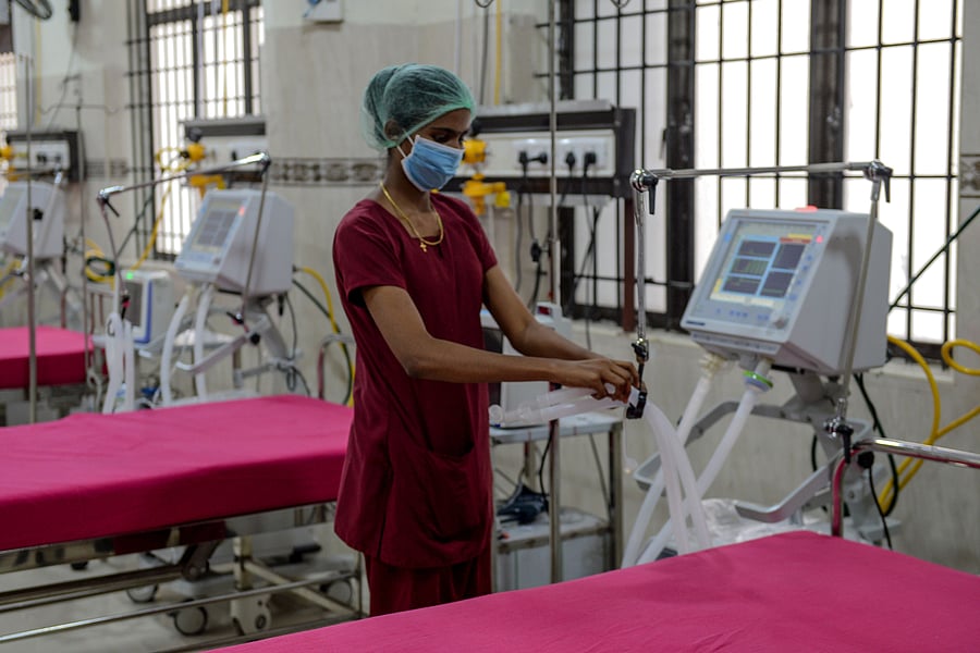 A medical staff checks on a ventilator of an intensive care unit. (Credit: AFP)