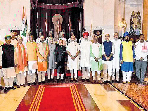One for the album: President Pranab Mukherjee, Vice-President Hamid Ansari and Prime Minister Narendra Modi with newly sworn-in ministers at Rashtrapati Bhavan in New Delhi on Tuesday. PTI