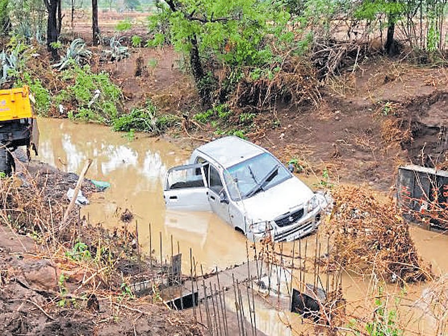 The vehicle which was washed away in Anavala stream of Kaladagi hobli, Bagalkot district late on Tuesday night.  DH photo