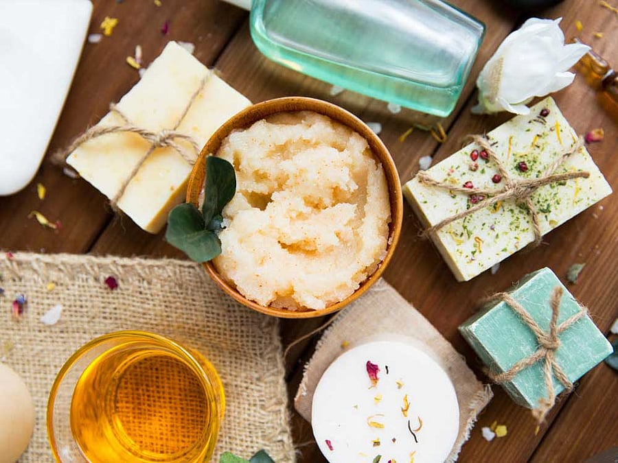 close up of body care cosmetic products on wood