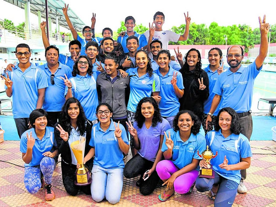 Champions Basavanagudi Aquatic Centre, winners of the overall title in the State Aquatic Championships. TOP ROW (from left): Achhuth, Shravanth, Prithvik, Prithvi. SECOND ROW FROM TOP: Anirudh, Sharath, Rakshit, Chandru, Avinash. THIRD ROW: Rahul, Prakash (coach), Smriti, Nikita, Damini Gowda, Riya,Shriya Bhat, Malavika, Padmanabha Rao (coach).KNEELING: Kushi, Preeti, Dhruti, Sneha, Mayuri, Saloni Dalal. DH PHOTO