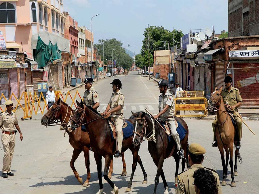 The curfew remained intact in four police station areas in the city for the third consecutive day. PTI Photo