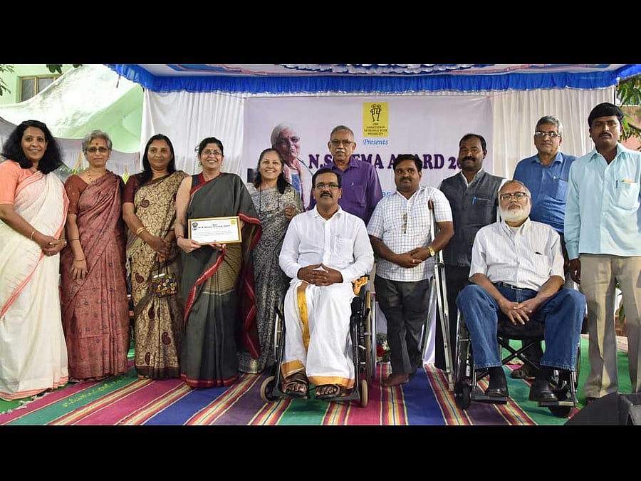 (From left) CEO of APD Christy Abraham, Vidya ADD India, Representative of Sevasta Madikeri, The winner of Vaishali Pai Founder Director Tamahar Trust, Rita James of Asha Kirana, Vinayak Rao of Seva Bharathi, Kanyadi, Dakshina Kannada, Representative of Seva Bharathi Mangalore, Raghu Hubbali of Asha Deepa Ilkal, Mohan Sundaram Jeery member, Alex Jeery member and Gangadhar of KAIV Bijapur during the program of N S Hema award 2017 at The Association of People with Disability, Lingarajpuram in Bengaluru on Wednesday. looks on. Photo by Janardhan B K