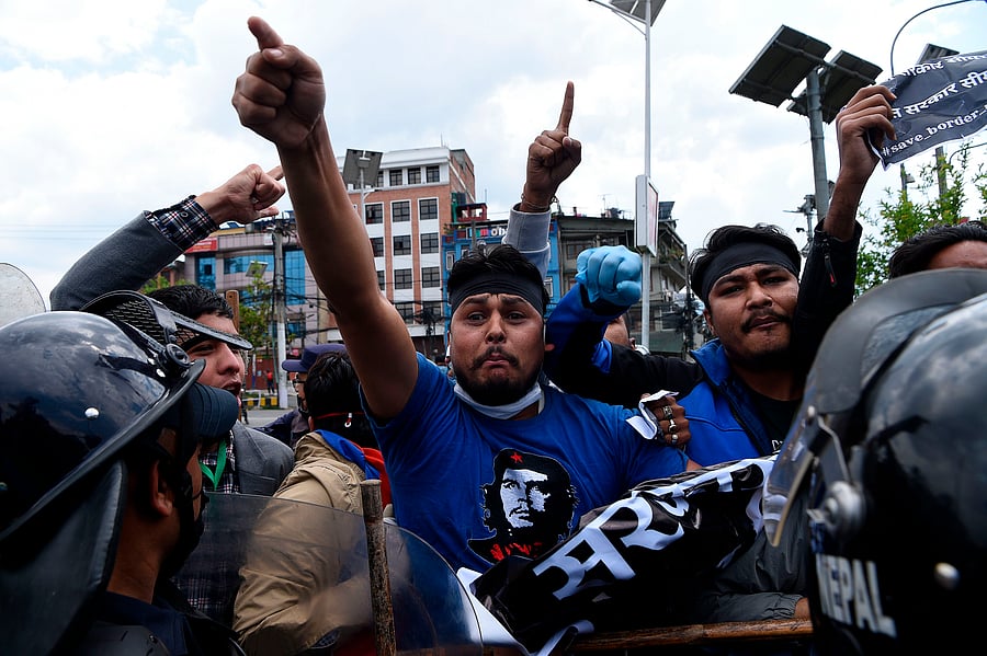 Police detain demonstrators during a protest against India's newly inaugurated link road to the Chinese border, in Kathmandu. (AFP Photo)
