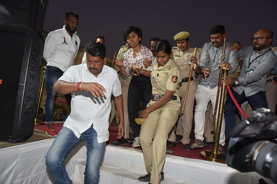 Amulya Leona being escorted by police after shouting 'Pakistan Zindabad' at an anti-CAA event in Freedom Park. DH photo
