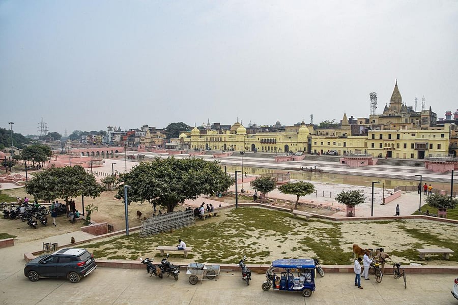 Commuters ride across a street near Ram Ki Paidi area in Ayodhya, Saturday, Oct. 19, 2019. (PTI Photo)
