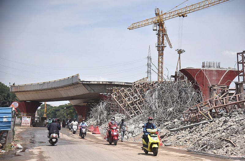Jayadeva circle flyover demolishing work is going on for Namma Metro rail construction in Bengaluru. (DH Photo)