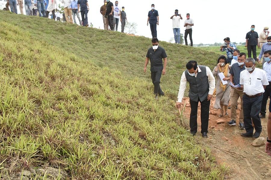 Assam Chief Minister Sarbananda Sonowal inspecting the work of an embankment in Golaghat district on Wednesday. (Photo credit: Assam govt.)