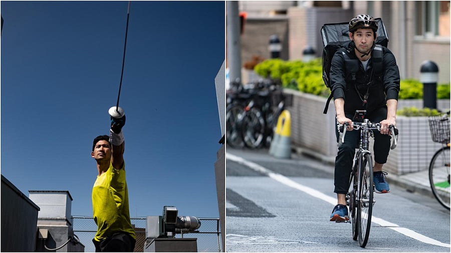 Japanese fencer Ryo Miyake riding his bike as he prepares for his food delivery job in Tokyo. - With the Tokyo 2020 Olympics postponed due to the COVID-19 coronavirus, top Japanese fencer Ryo Miyake has swapped his metal mask and foil for a bike and backpack as a Tokyo UberEats deliveryman. (Photo by AFP)