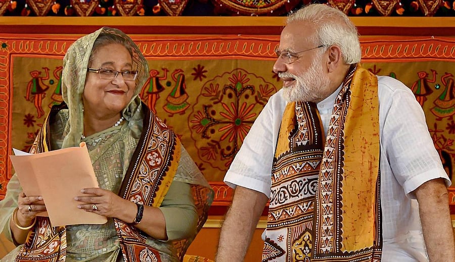 Prime Minister Narendra Modi speaks with his Bangladeshi counterpart Sheikh Hasina during the annual convocation of Visva Bharati University, in Birbhum. Credit: PTI Photo