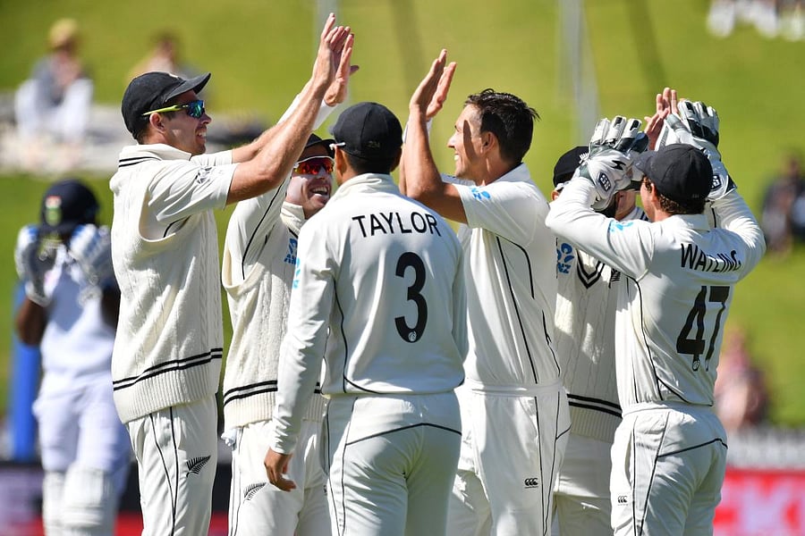 New Zealand's players celebrate bowling India's Ajinkya Rahane during day four of the first Test cricket match between New Zealand and India at the Basin Reserve in Wellington on February 24, 2020. (Photo by Marty MELVILLE / AFP)
