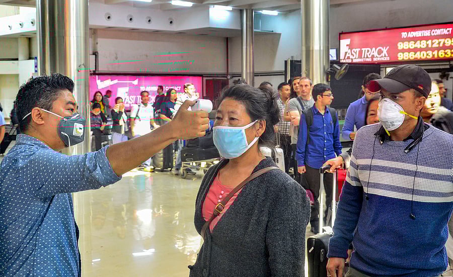 Passengers undergo a thermal screening test in the wake of novel coronavirus scare at Dimapur airport in Nagaland. (Credit: PTI)