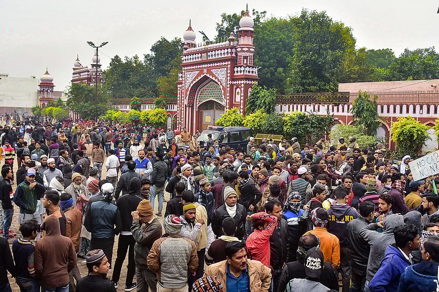People gather at the Eidgah to protest against the alleged police action on AMU students who were protesting over Citizenship Amendment Act, in Aligarh, Monday, Dec. 16, 2019. (PTI Photo)