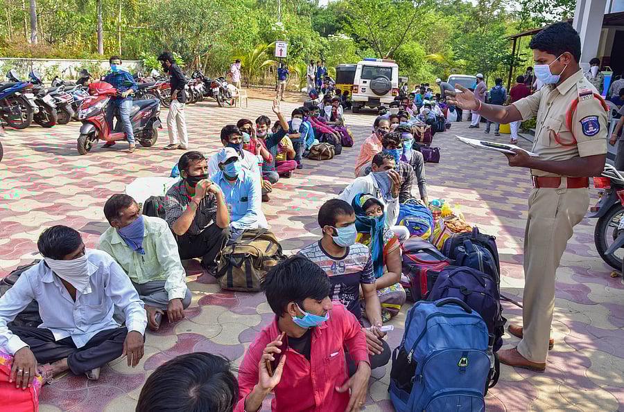 A policeman collects details of migrants before sending them to their native places via a train, during the ongoing nationwide COVID-19 lockdown. (PTI Photo)