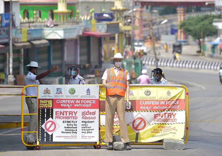 A mannequin dressed in traffic uniform is seen installed at Mysore road during the nationwide lockdown imposed in the wake of coronavirus pandemic, in Bengaluru. (Credit: PTI Photo)