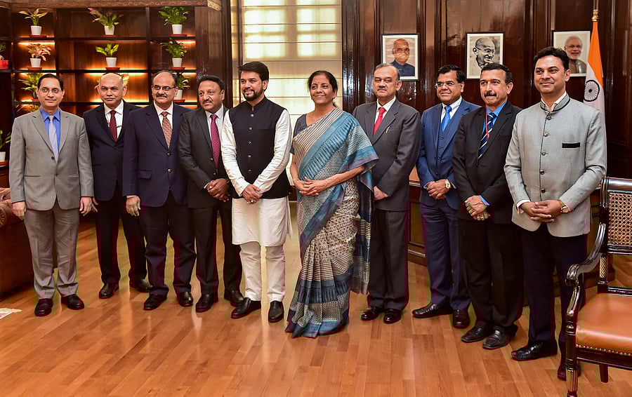 Union Finance Minister Nirmala Sitharaman, MoS Finance Anurag Thakur and finance ministry officials pose for a photograph after giving final touches to the Union Budget 2020-21, at Finance Ministry, in New Delhi. (PTI Photo)
