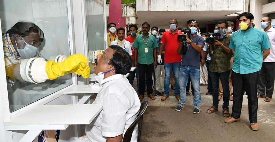 A sample collection demonstration using Walk-in Sample Kiosk in Kochi on Monday. (DH Photo)