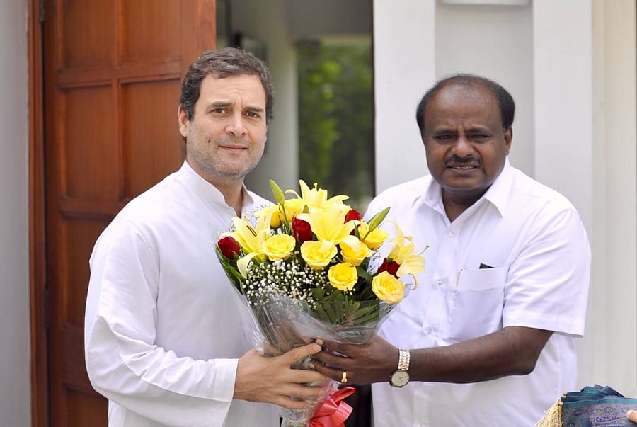 Karnataka Chief Minister H D Kumaraswamy greets Congress president Rahul Gandhi, at his residence in New Delhi on Thursday. (pic Special Arrangement)