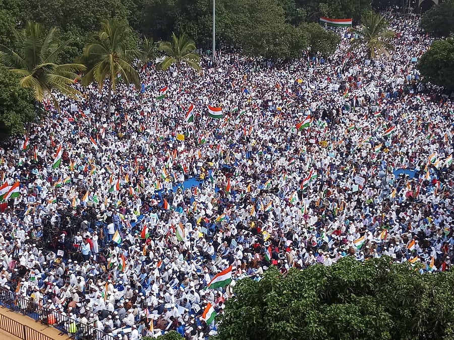 Waving the national flag and holding placards, the protestors raised slogans demanding withdrawal of the NRC and CAA as they marched through city roads. (DH Photo by Janardhan BK)