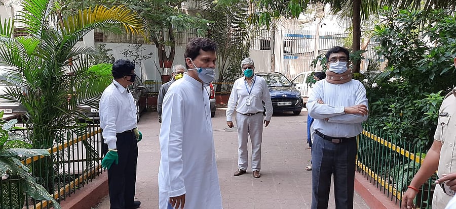 Prof Anand Teltumbde (R) outside the NIA office. (DH Photo)