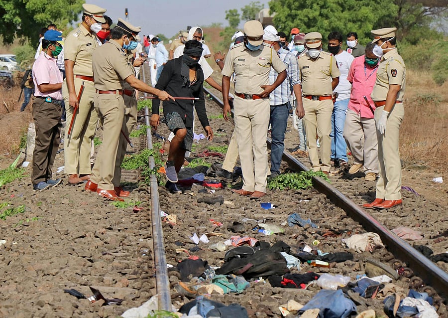 Police officers examine the railway track after a train ran over migrant workers sleeping on the track in Aurangabad district in the western state of Maharashtra, India, May 8, 2020. Credit: Reuters File Photo