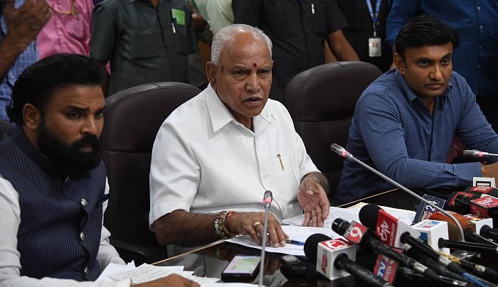 Chief Minister BS Yeddurappa (C), Health Minister Sriramulu (L) and Medical Education Minister Dr K Sudhakar (R) address a press conference on coronavirus cases in Bengaluru at Vidhana Soudha. (DH file photo by B H Shivakumar) 