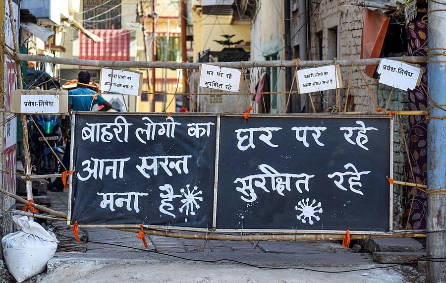  A poster put up at a barricade informs passersby to not enter the area during the nationwide lockdown to curb the spread of coronavirus (PTI Photo)