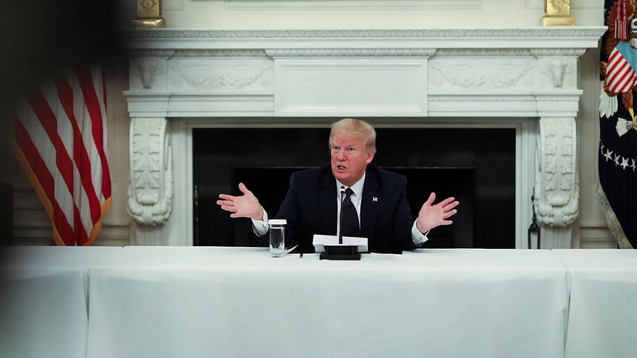 US President Donald Trump talks about taking hydroxychloroquine at coronavirus response event with restaurant executives at White House in Washington. Reuters