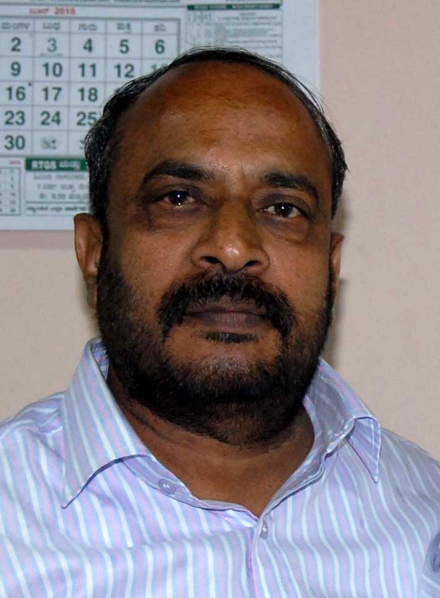 S L Dharme Gowda