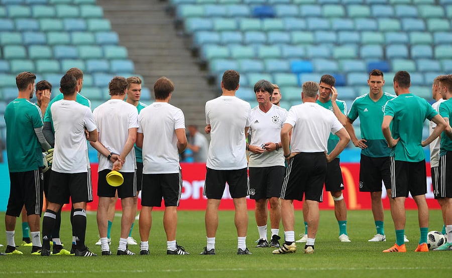 Most of the rubble and carcasses of burnt-out cars have been removed but it's hard to ignore the gutted buildings outside the market