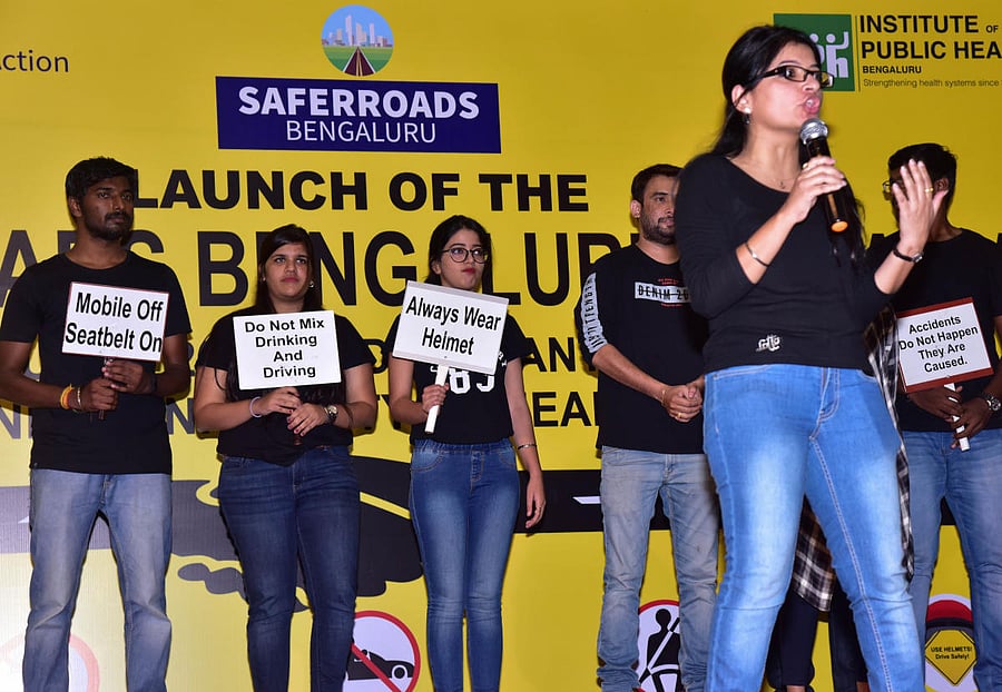 Employees of AXA create awareness during the launch of the 'Safer Roads Bengaluru' initiative at the Rajiv Gandhi University of Health Sciences (RGUHS) on Friday. 