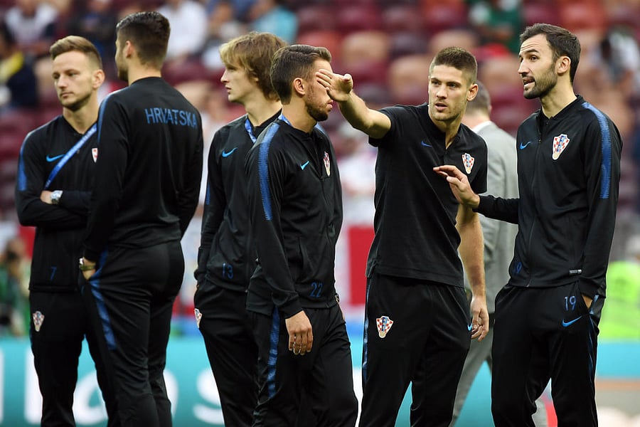 Croatia's defender Josip Pivaric, Croatia's forward Andrej Kramaric and Croatia's midfielder Milan Badelj chat before the Russia 2018 World Cup semi-final football match between Croatia and England at the Luzhniki Stadium in Moscow on July 11, 2018. / AFP